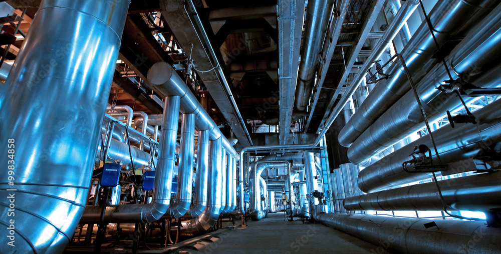 Obraz premium Industrial zone, Steel pipelines and cables in blue tones