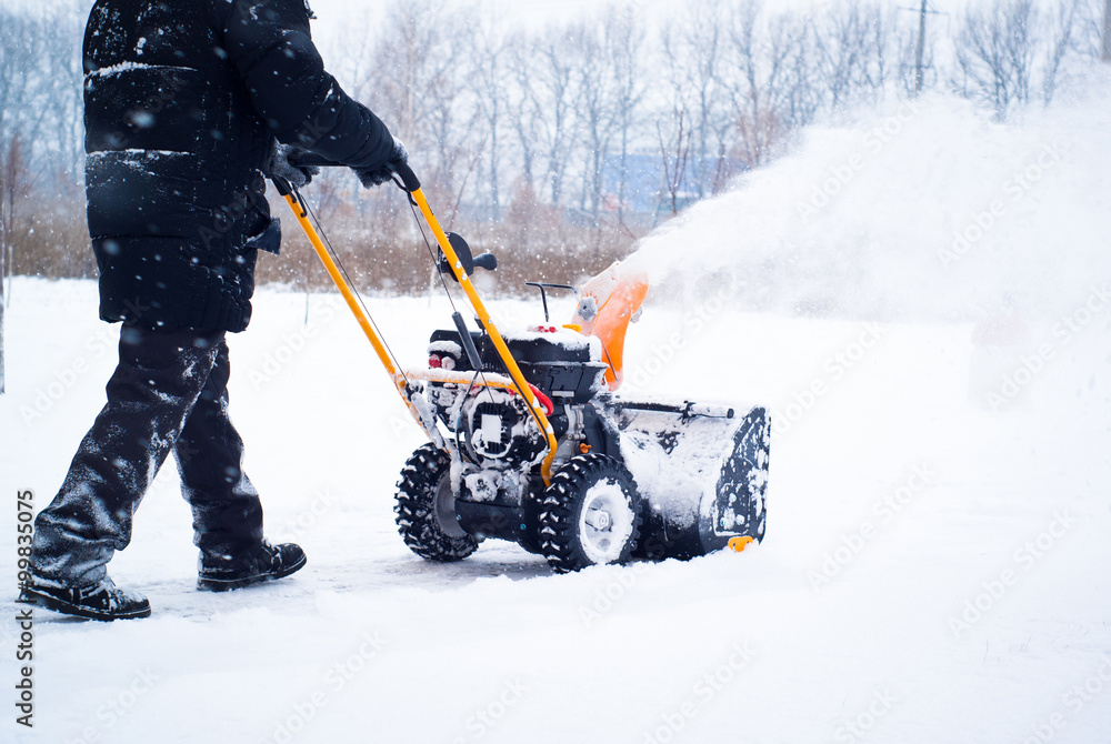 Fototapeta premium A man cleans snow