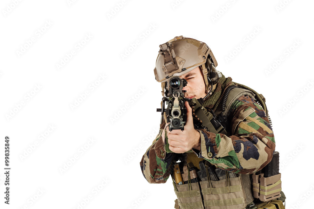 young ranger standing with a machine gun at white background young ranger standing with a machine gun at white background