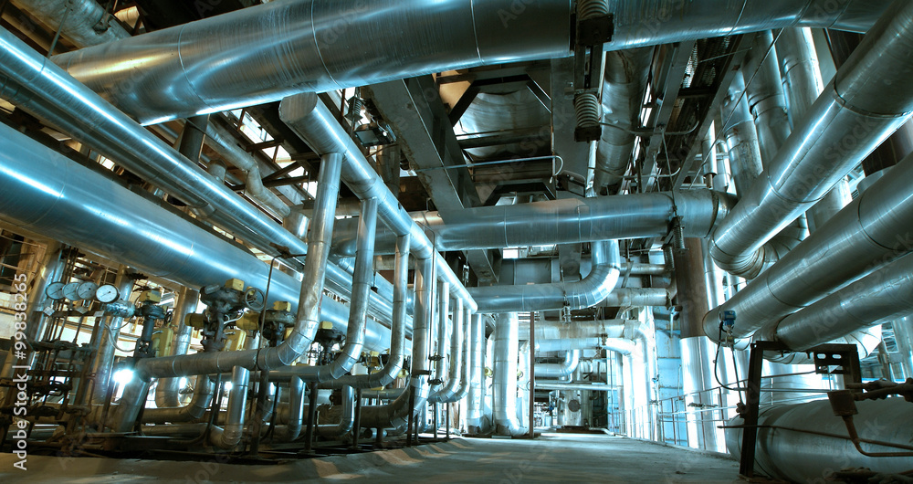 Steel pipelines and valves in blue tones Steel pipelines and valves in blue tones
