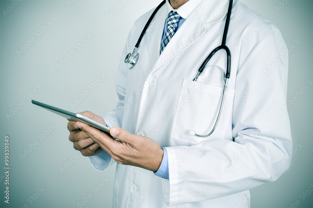 doctor man using a tablet computer doctor man using a tablet computer