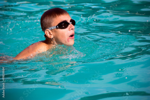 boy swim in the pool