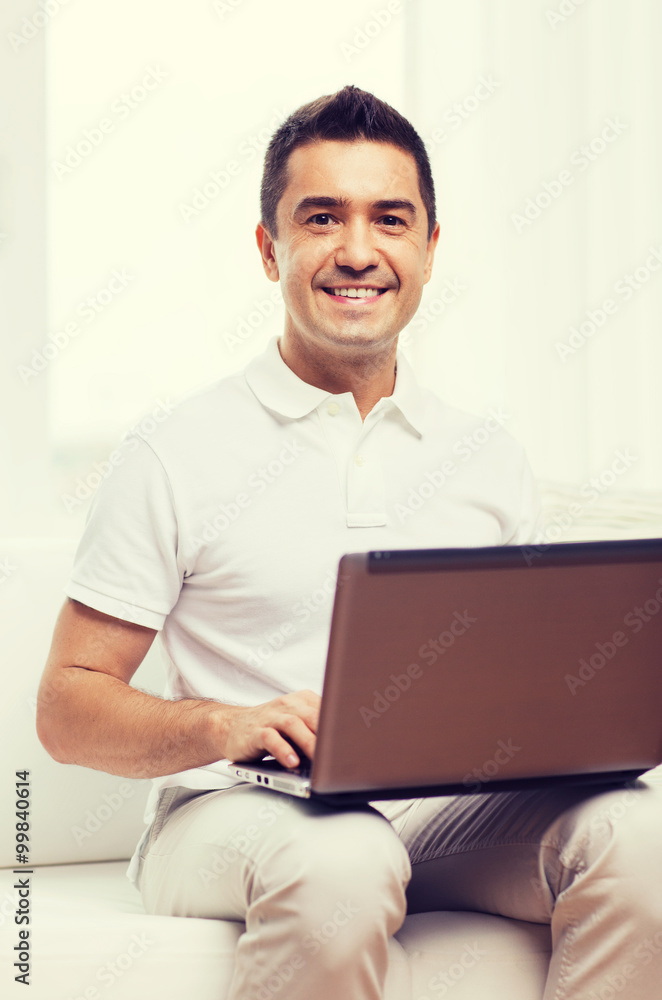 happy man working with laptop computer at home happy man working with laptop computer at home