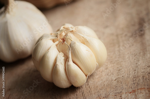 heap garlic on wood background