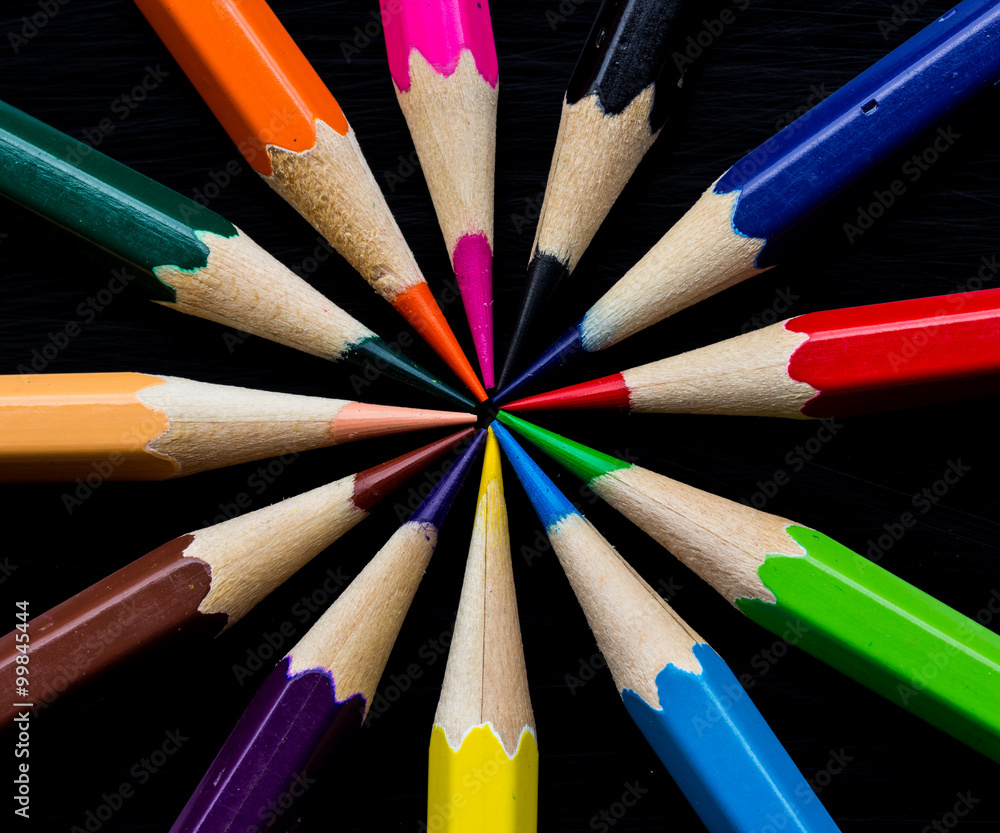 Fototapeta premium Color pencils on black background