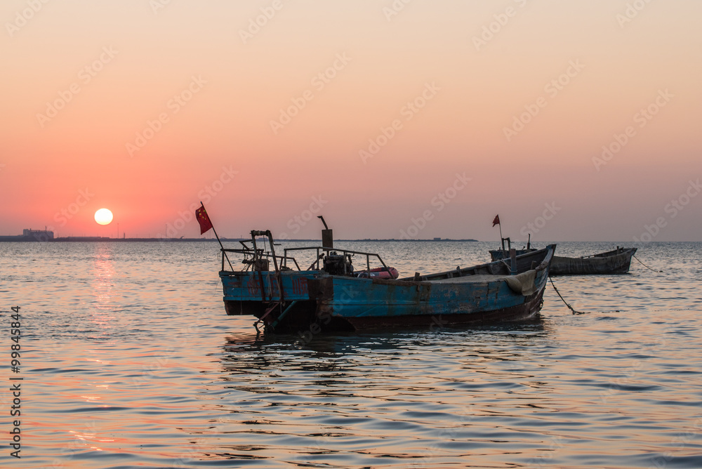 old fishing boat at sunset time -yantai,china