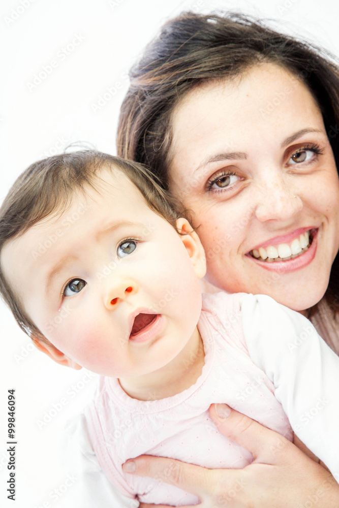 close-up of a smiling young woman with her baby on white background close-up of a smiling young woman with her baby on white background