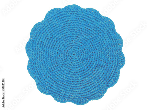 Crochet blue placemat on white background