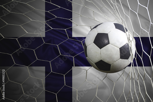 Finland flag and soccer ball, football in goal net