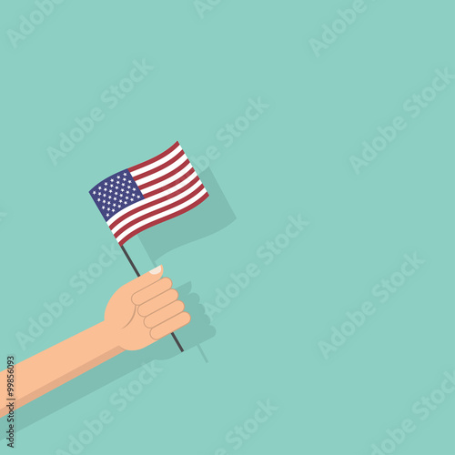 Hand holding the United States of America flag