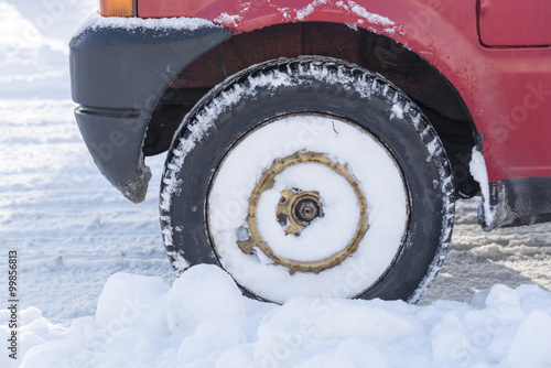 Wheel of car in heavy snow.