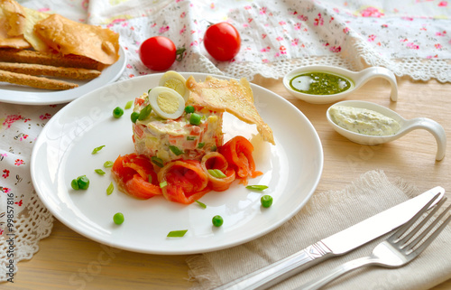 Salad with a salmon and quail egg