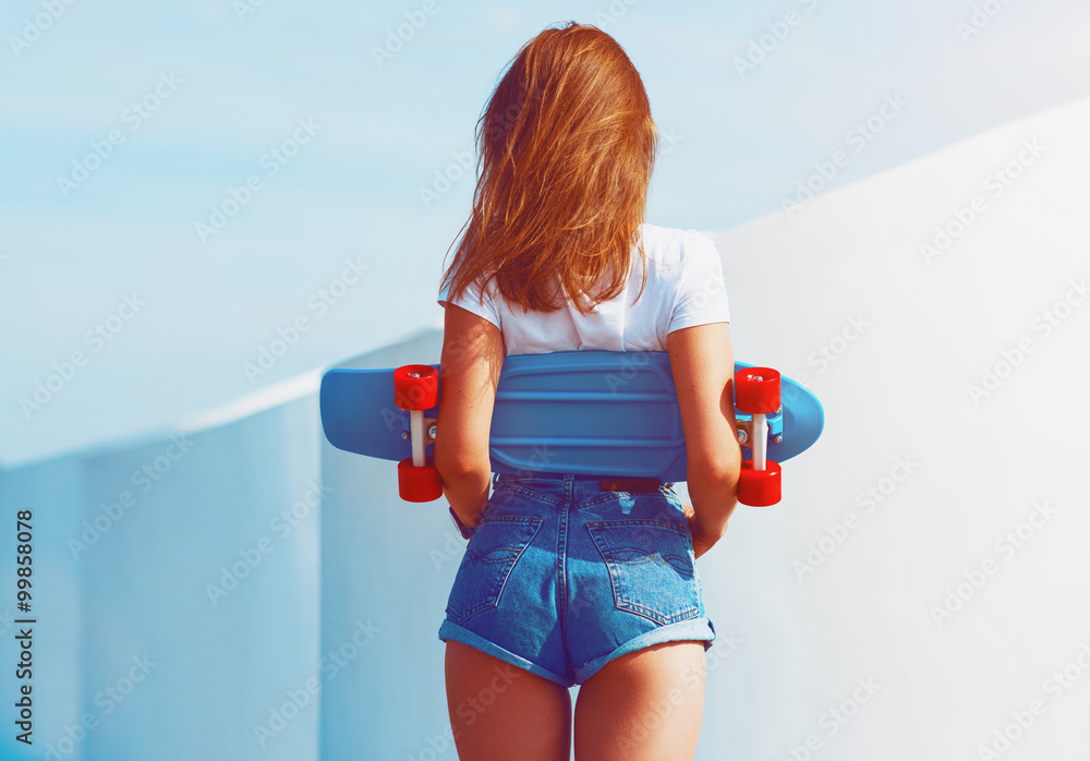 Beautiful sexy young girl in short shorts walking with longboard in sunny  weather. Leisure. Healthy lifestyle. Extreme sports. Fashion look Stock  Photo | Adobe Stock