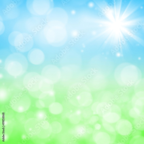 Abstract bright spring background with blurry grass and sky