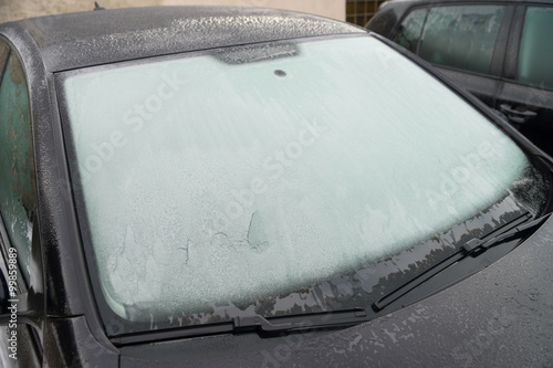 frozen windshield   frozen windshield of a car