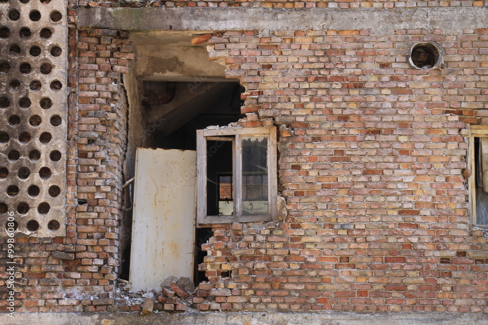 Old destroyed window on brick wall in Sarajevo , Bosnia and Herzegovina