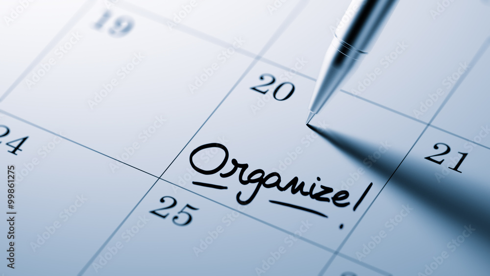 Closeup of a personal agenda setting an important date written w Closeup of a personal agenda setting an important date written w