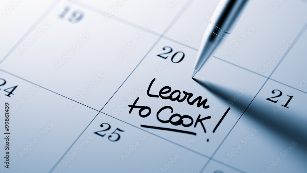 Closeup of a personal agenda setting an important date written w Closeup of a personal agenda setting an important date written w