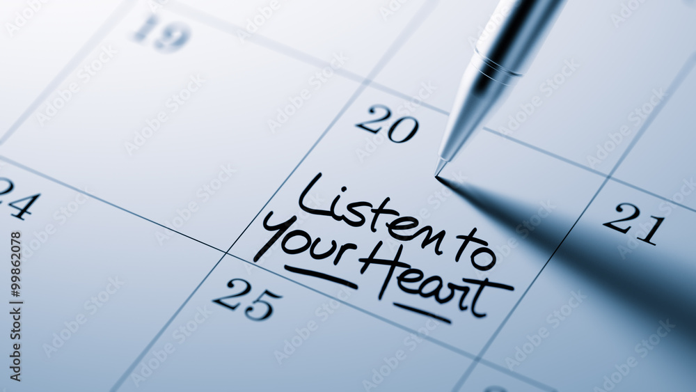 Closeup of a personal agenda setting an important date written w Closeup of a personal agenda setting an important date written w