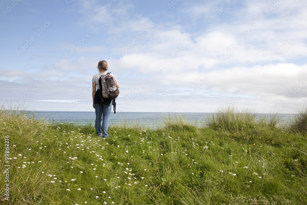 Female Treker on the Isle of Sanday, Orkney Islands, Scotland Female Treker on the Isle of Sanday, Orkney Islands, Scotland