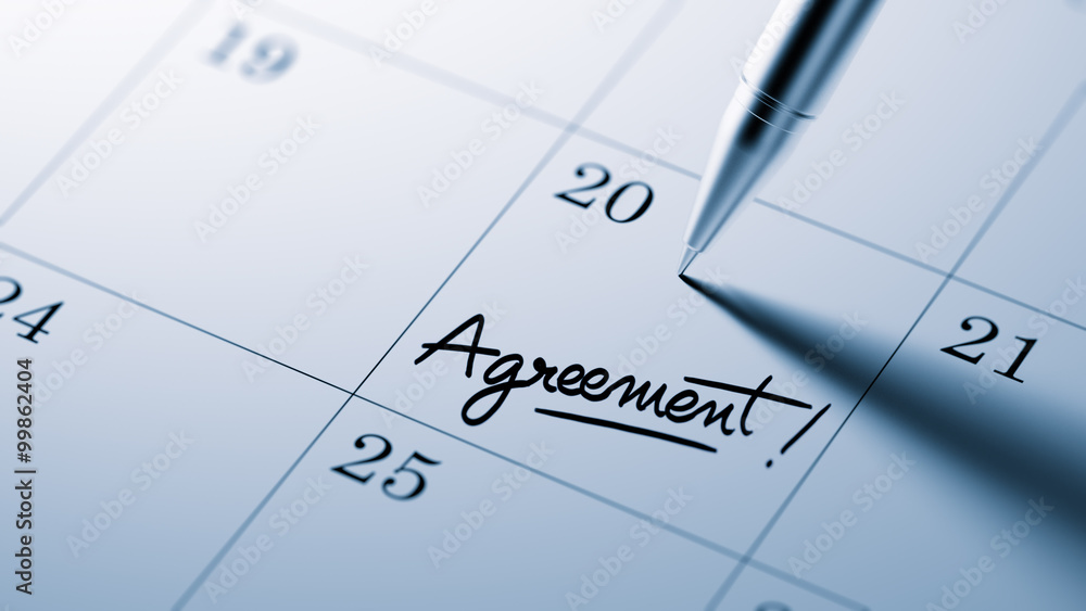Closeup of a personal agenda setting an important date written w Closeup of a personal agenda setting an important date written w