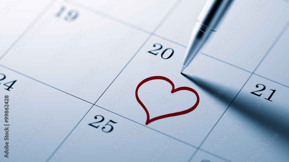 Fototapeta premium Closeup of a personal agenda setting an important date written w