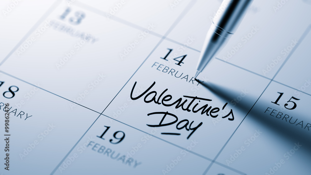 Closeup of a personal agenda setting an important date written w Closeup of a personal agenda setting an important date written w