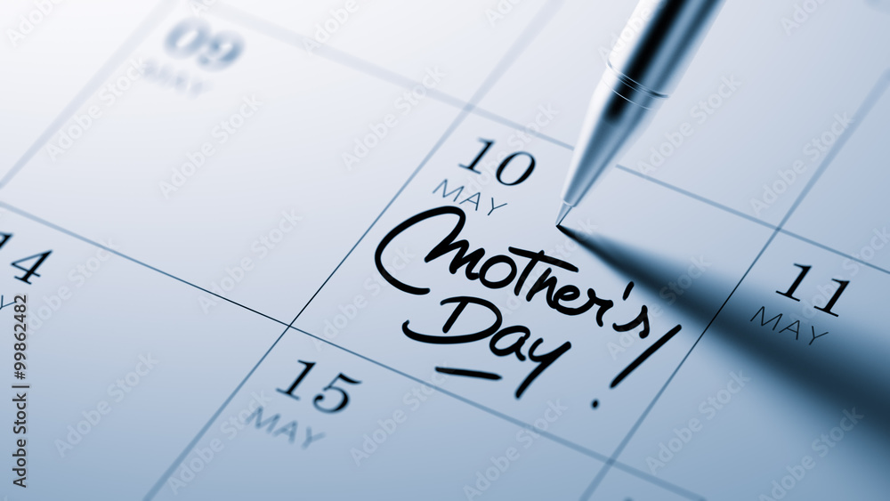 Closeup of a personal agenda setting an important date written w Closeup of a personal agenda setting an important date written w