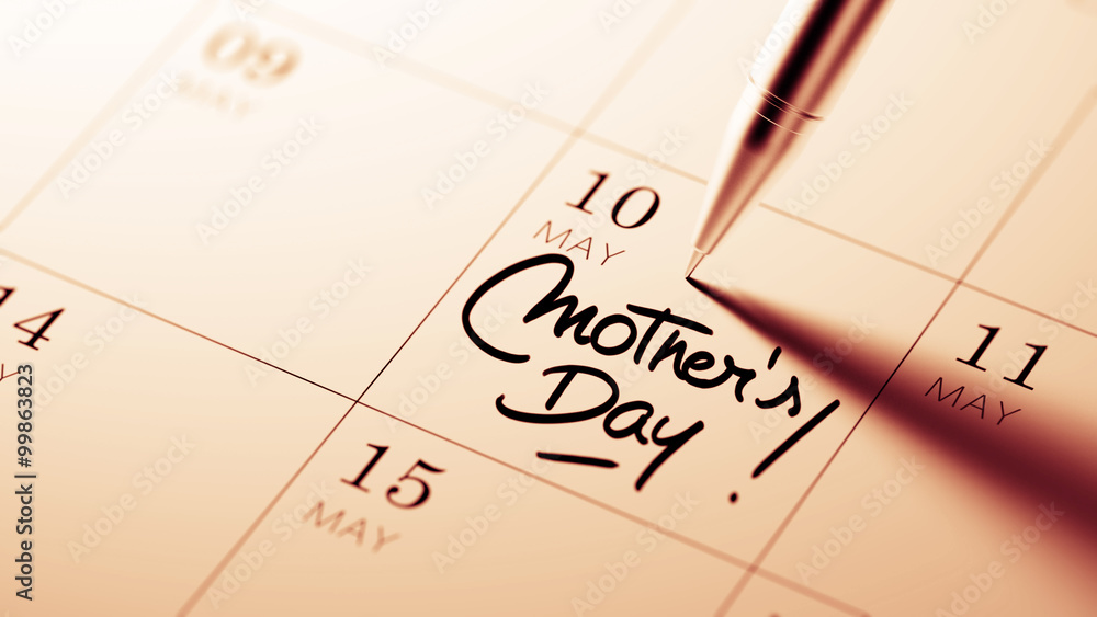 Closeup of a personal agenda setting an important date written w Closeup of a personal agenda setting an important date written w