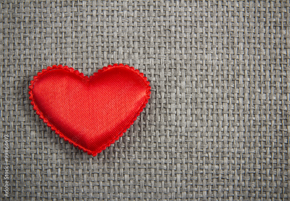 Red textile heart  on grey wicker background. Valentines Day card