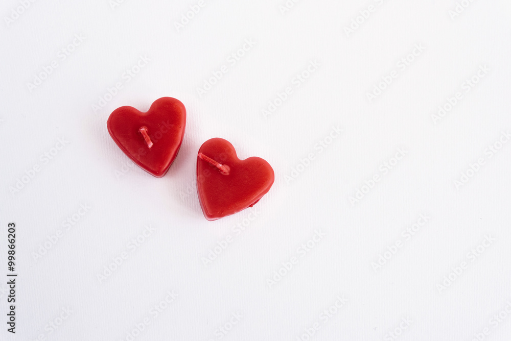two heart red candles isolated on white background, valentine gr