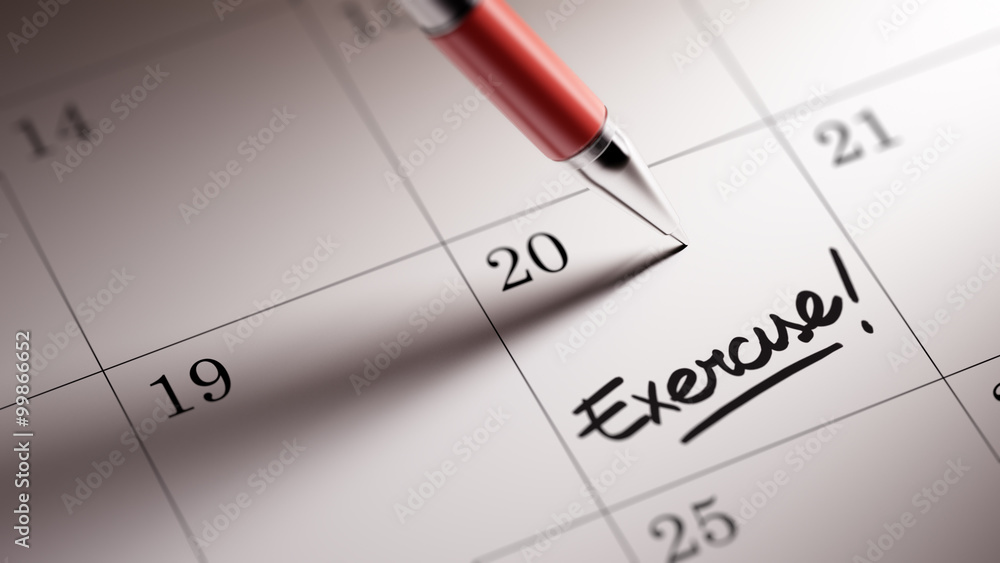 Closeup of a personal agenda setting an important date written w Closeup of a personal agenda setting an important date written w