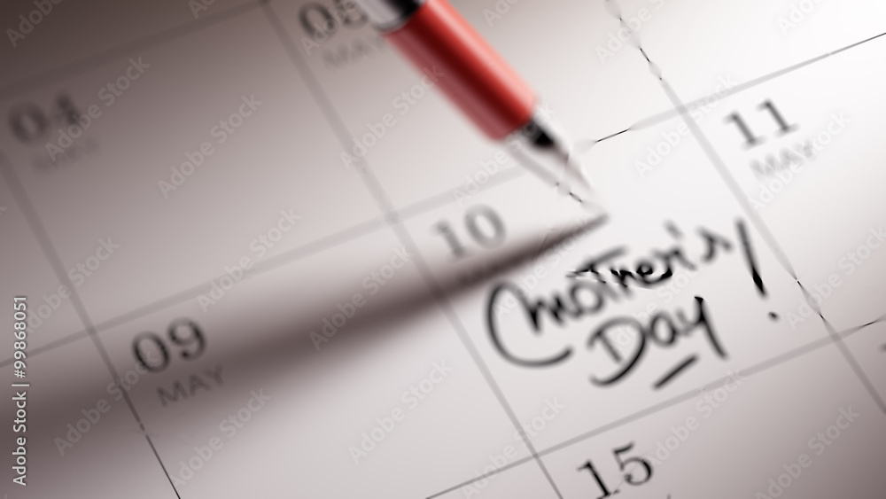 Closeup of a personal agenda setting an important date written w Closeup of a personal agenda setting an important date written w