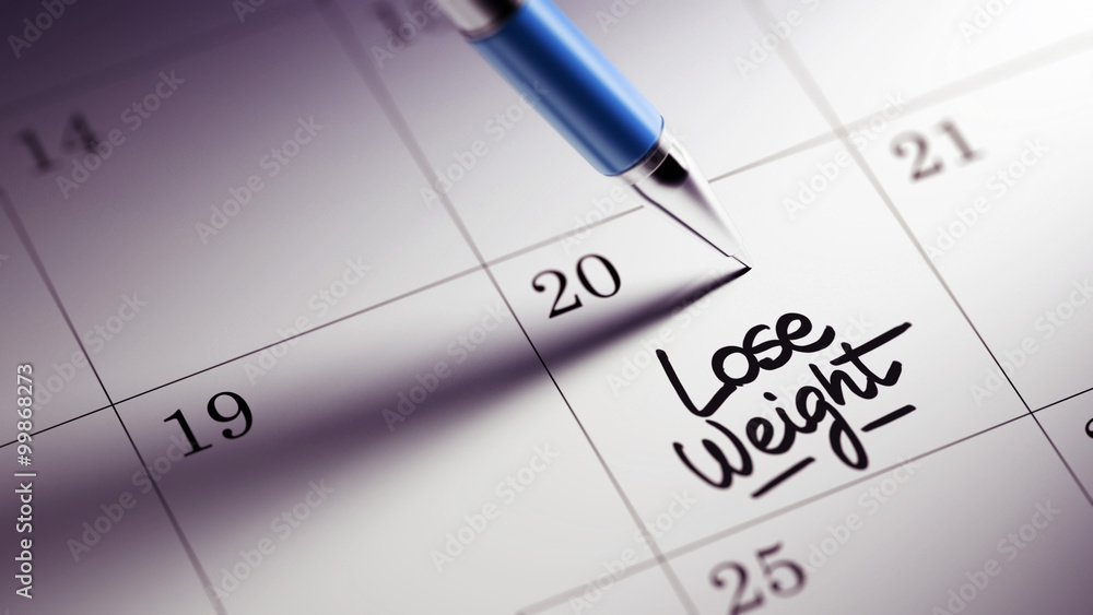 Closeup of a personal agenda setting an important date written w Closeup of a personal agenda setting an important date written w