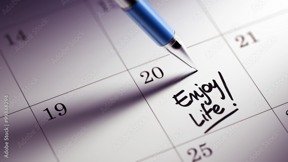 Closeup of a personal agenda setting an important date written w Closeup of a personal agenda setting an important date written w