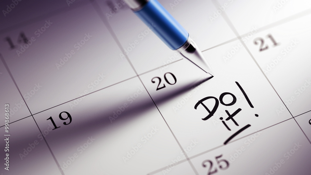 Closeup of a personal agenda setting an important date written w Closeup of a personal agenda setting an important date written w