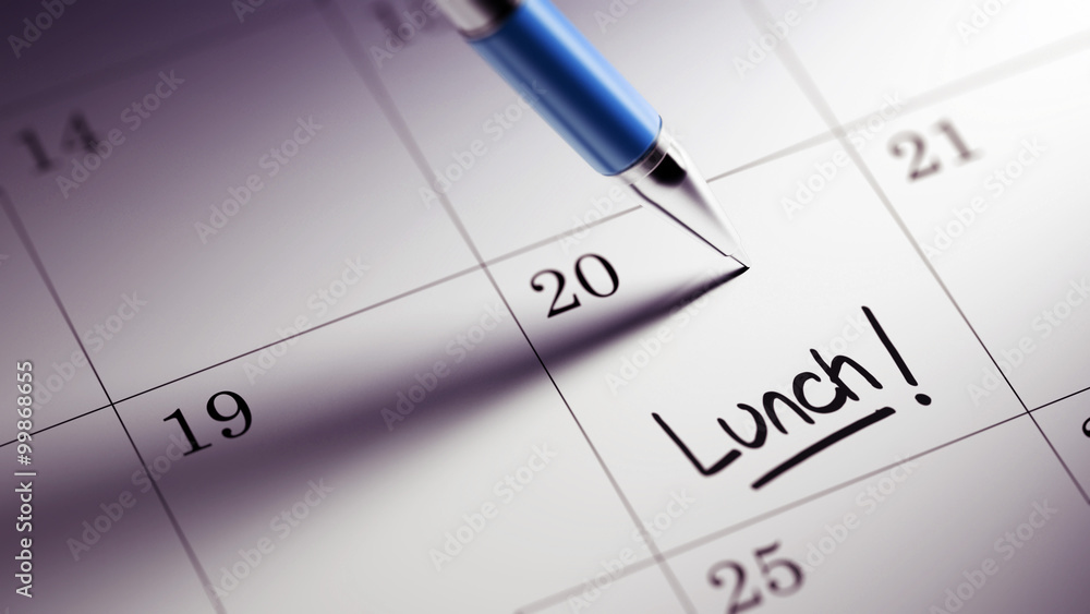 Closeup of a personal agenda setting an important date written w Closeup of a personal agenda setting an important date written w