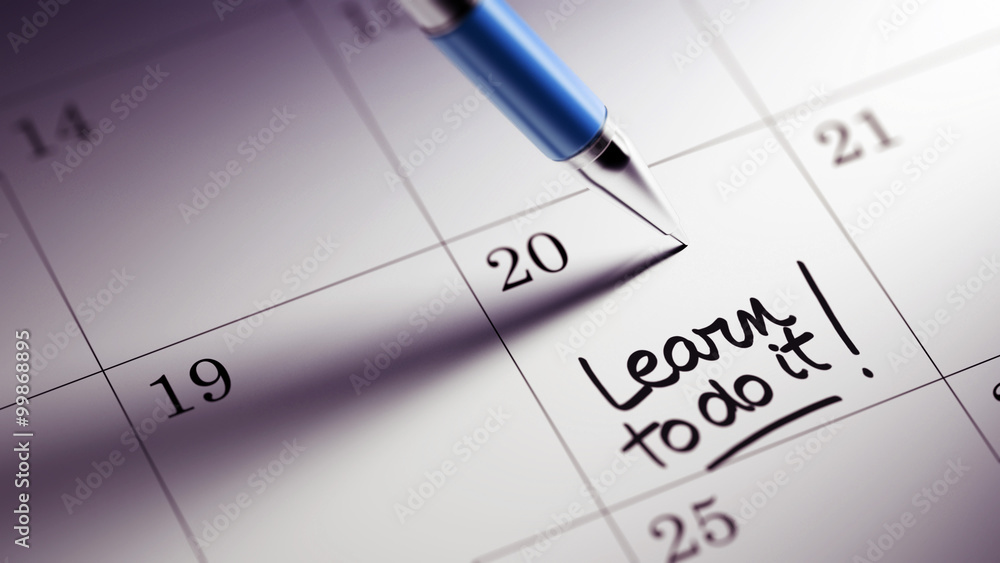 Closeup of a personal agenda setting an important date written w Closeup of a personal agenda setting an important date written w