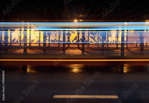 Vehicular light trails and graffiti under the bridge in Katowice