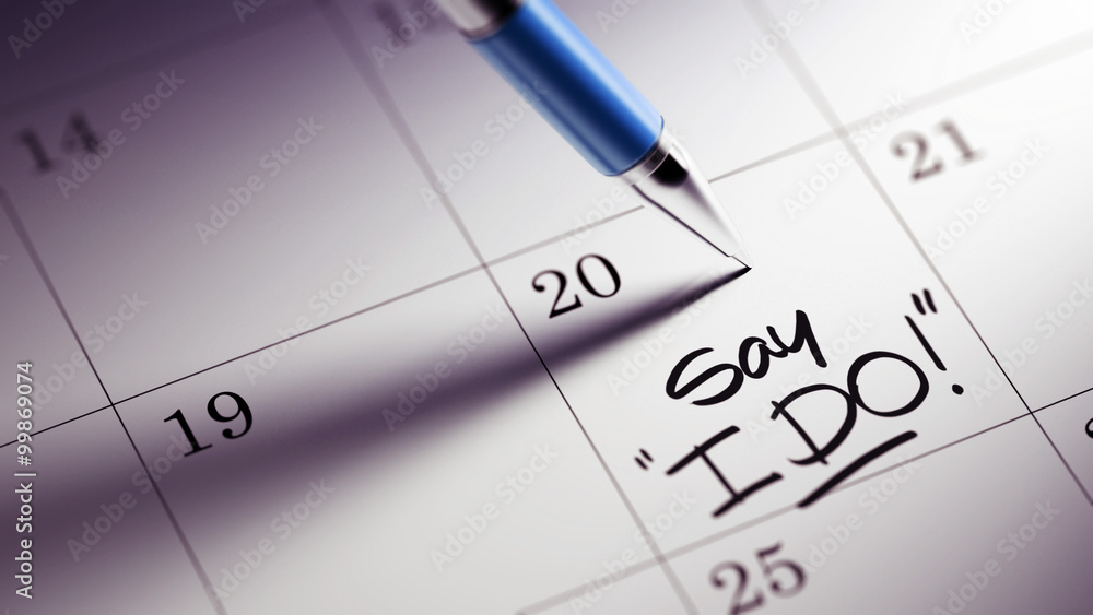 Closeup of a personal agenda setting an important date written w Closeup of a personal agenda setting an important date written w