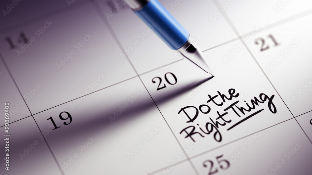 Closeup of a personal agenda setting an important date written w Closeup of a personal agenda setting an important date written w