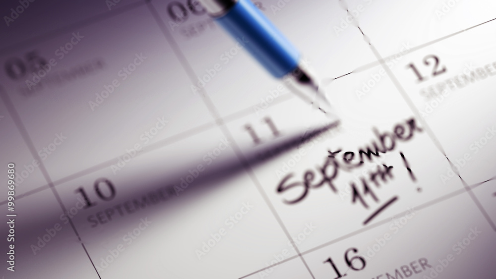 Closeup of a personal agenda setting an important date written w Closeup of a personal agenda setting an important date written w