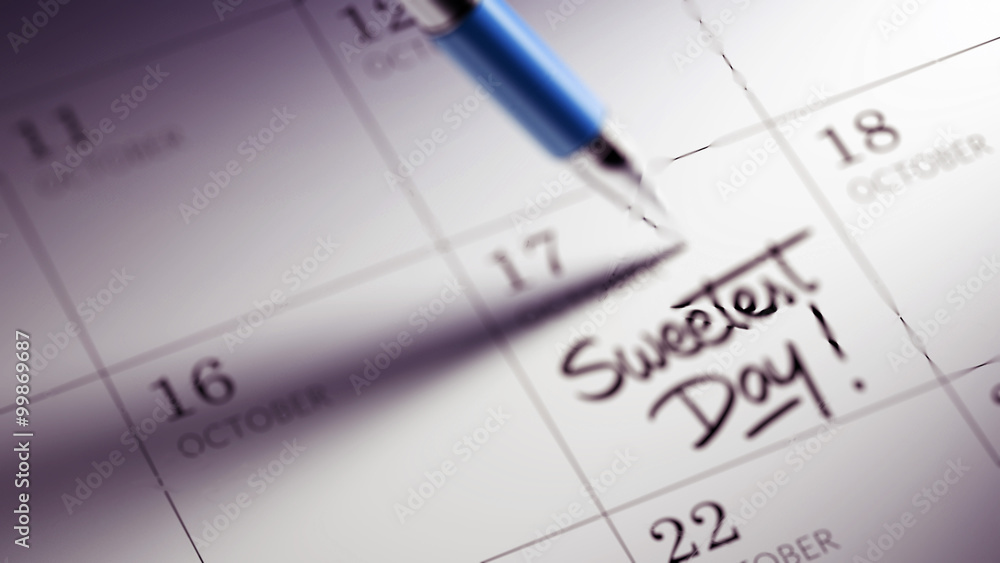 Closeup of a personal agenda setting an important date written w Closeup of a personal agenda setting an important date written w