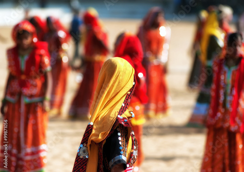 Girls in traditional indian clothes dancing in Rajasthan, India © Banana Republic