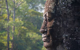 Profile view of ancient sculpture in Angkor Wat historical site in Cambodia