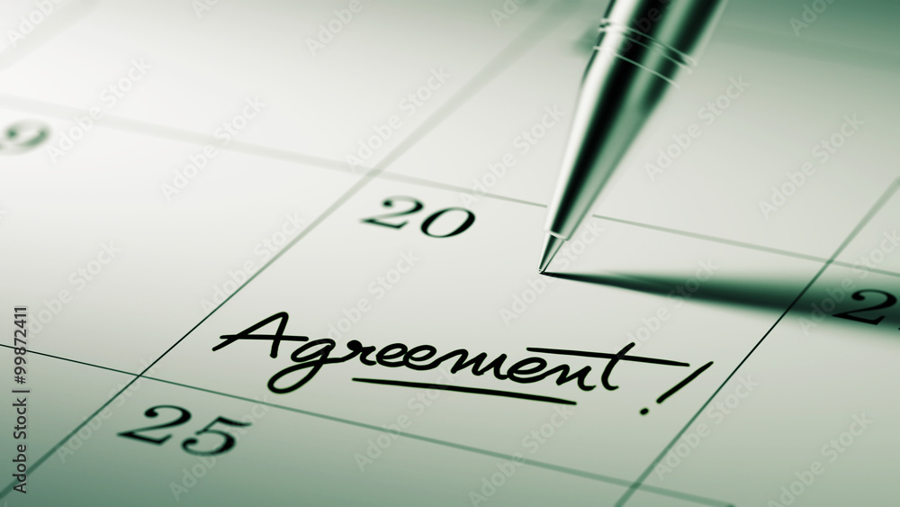 Closeup of a personal agenda setting an important date written w Closeup of a personal agenda setting an important date written w