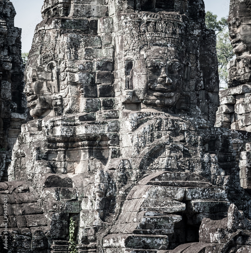 Fototapeta premium Faces and figures in Angkor Wat Cambodia. Bayon temple in Angkor Thom