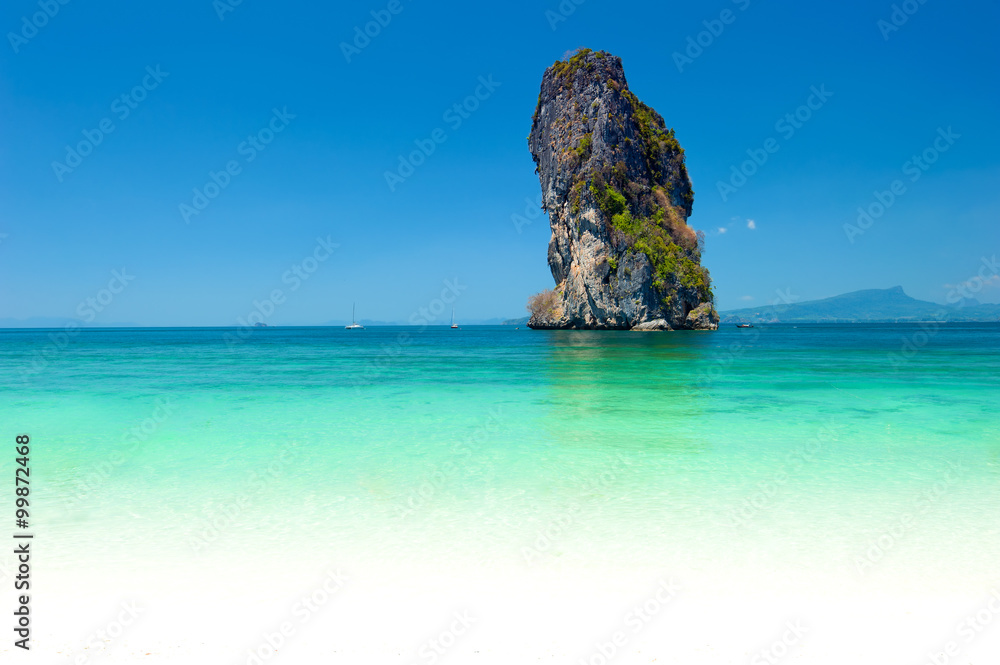 Natural rock formation in turquoise water of tropical sea in Thailand near Phuket island. Seaside photography