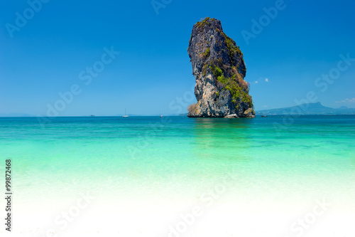 Natural rock formation in turquoise water of tropical sea in Thailand near Phuket island. Seaside photography