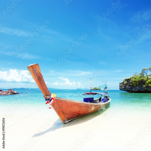 Adventure background. Wooden tourist boat on shore of Asian tropical resort. Traveling to Thailand © Banana Republic
